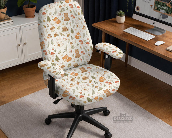 A gaming chair cover with a woodland animal print featuring foxes, rabbits, bears, mushrooms, and leaves in green, brown, and beige tones.