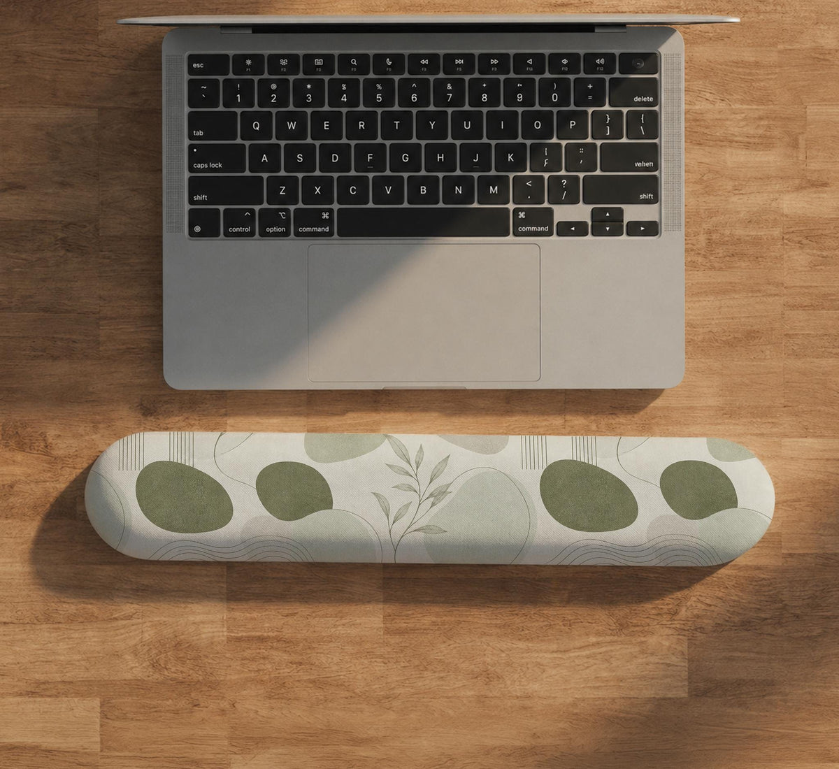 Green abstract botanical mouse pad with a rounded organic pattern and matching keyboard wrist rest option.