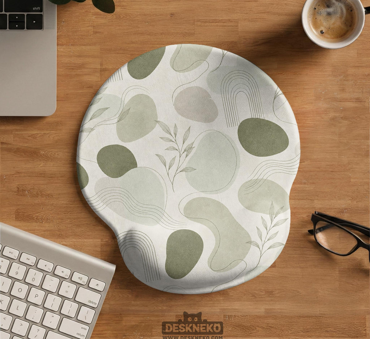 Green abstract botanical mouse pad with a rounded organic pattern and matching keyboard wrist rest option.
