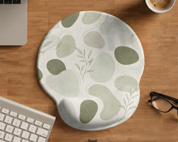 Green abstract botanical mouse pad with a rounded organic pattern and matching keyboard wrist rest option.