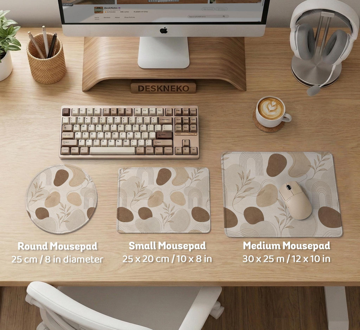 Beige desk mat with fine botanical line drawings and soft abstract shapes on a light neutral background.
