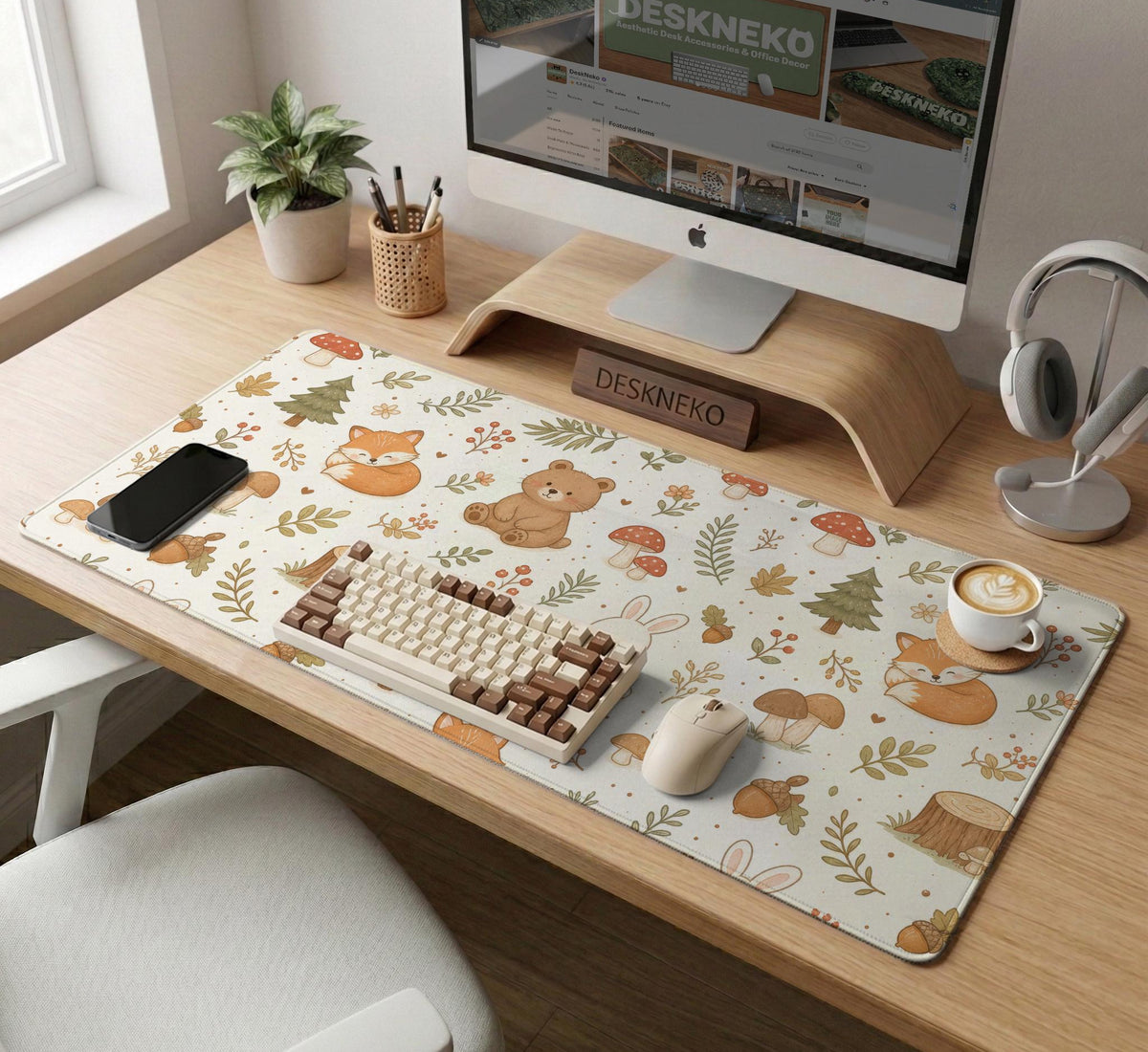 Cream desk mat with a woodland animal pattern featuring foxes, bunnies, mushrooms, berries, acorns, and sage leaves in soft green tones.