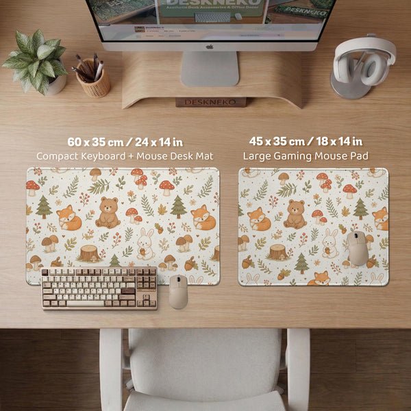 Cream desk mat with a woodland animal pattern featuring foxes, bunnies, mushrooms, berries, acorns, and sage leaves in soft green tones.