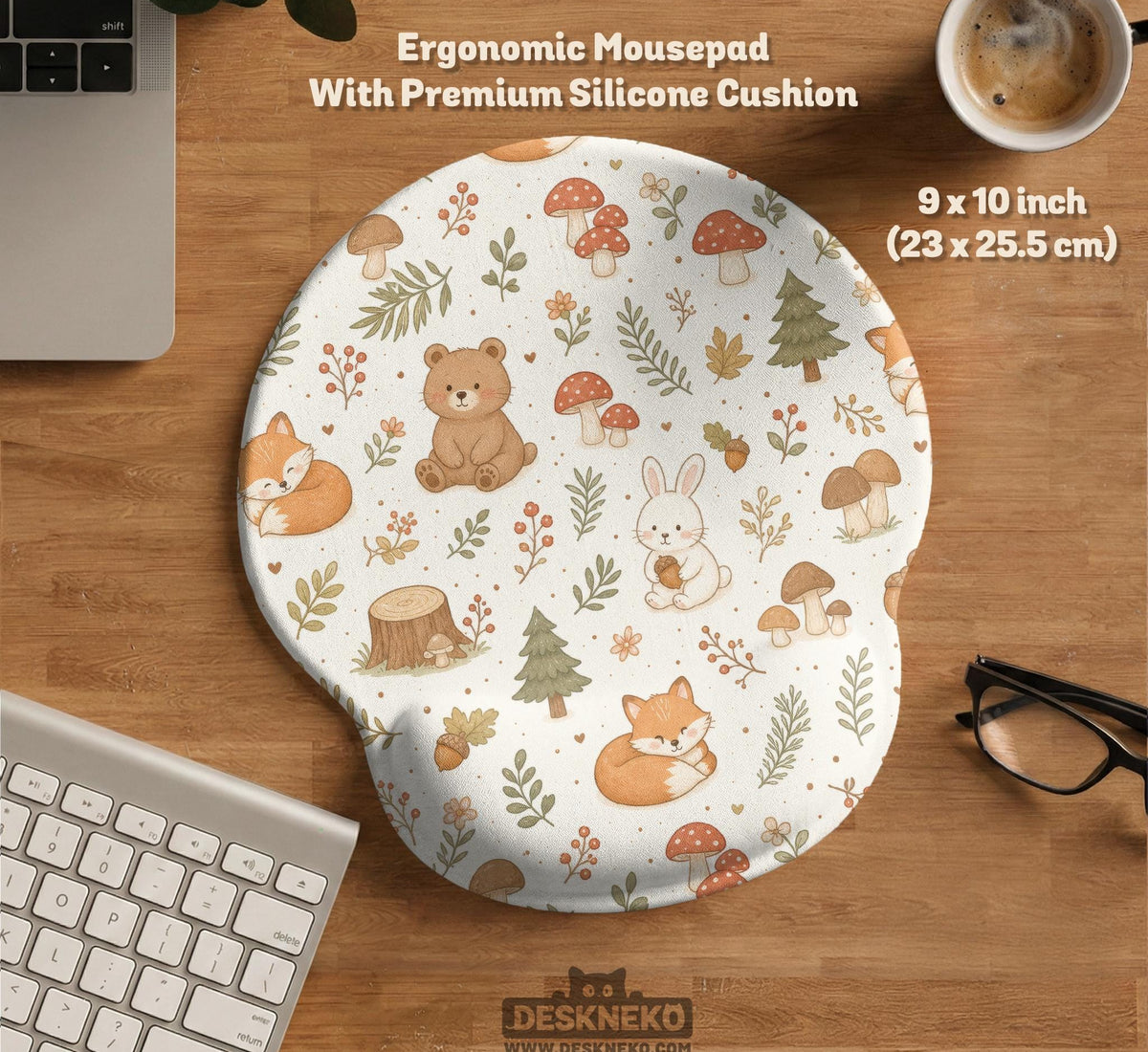 Cream desk mat with a woodland animal pattern featuring foxes, bunnies, mushrooms, berries, acorns, and sage leaves in soft green tones.