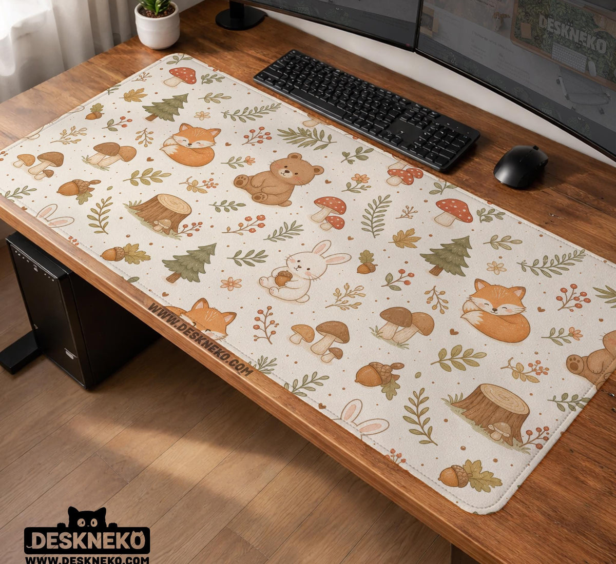 Cream desk mat with a woodland animal pattern featuring foxes, bunnies, mushrooms, berries, acorns, and sage leaves in soft green tones.