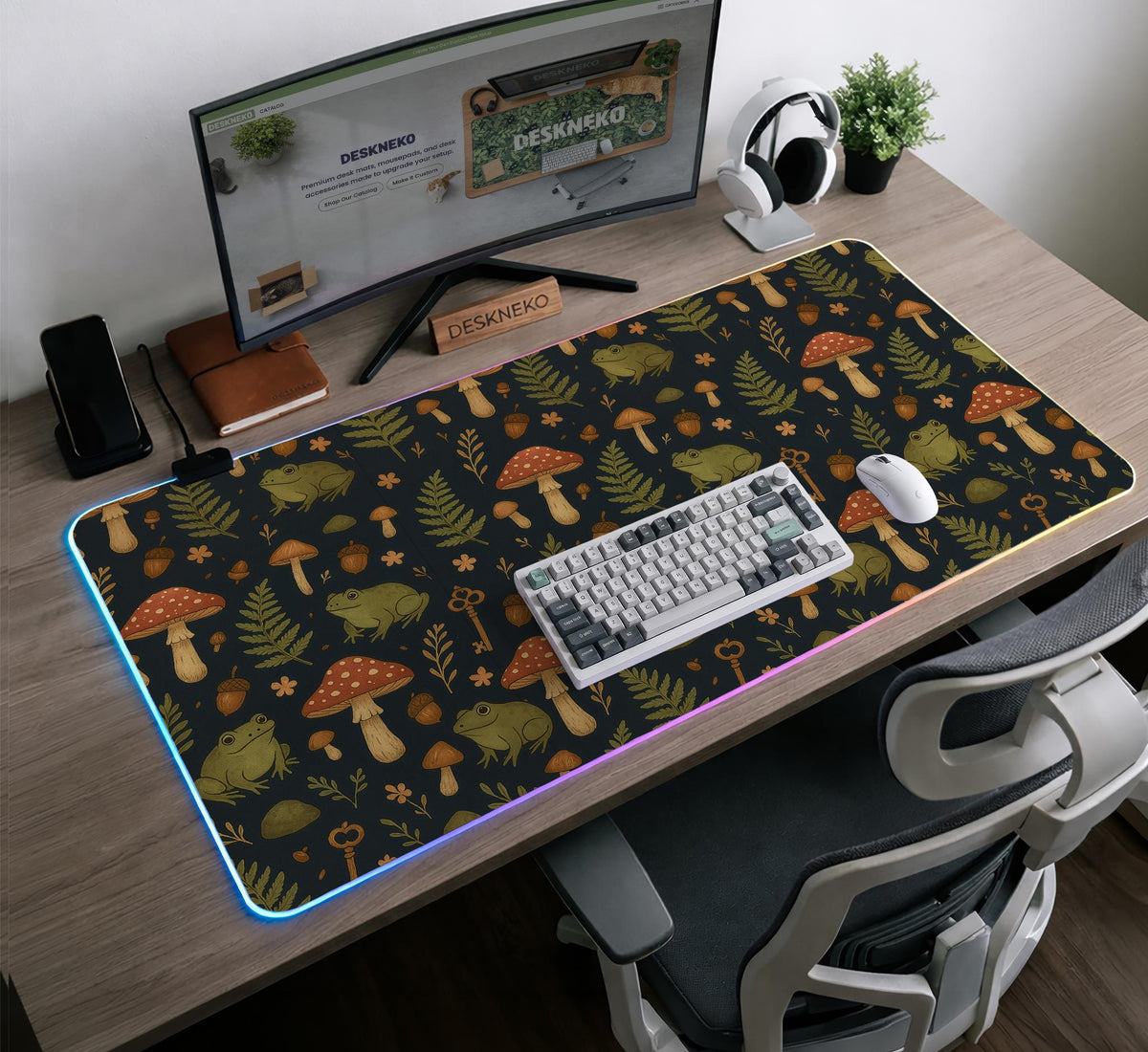 Dark forest-themed desk mat with an all-over pattern of frogs, mushrooms, fern leaves, acorns, tiny flowers, and antique keys.