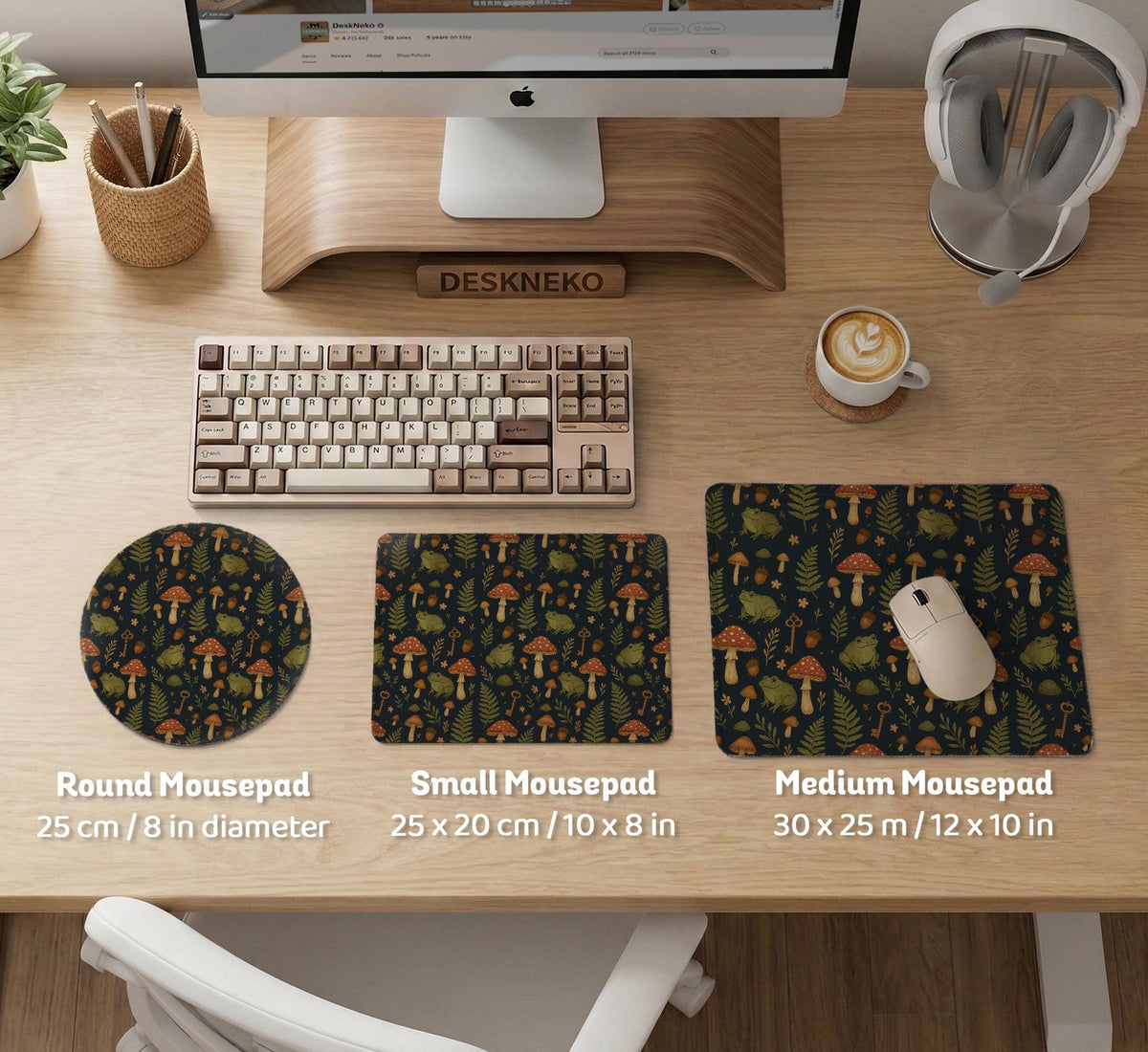 Dark forest-themed desk mat with an all-over pattern of frogs, mushrooms, fern leaves, acorns, tiny flowers, and antique keys.