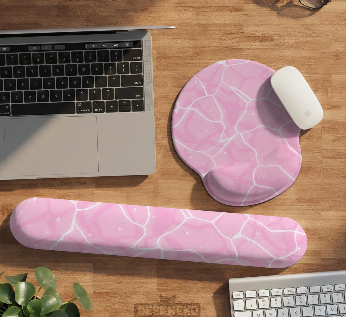 Soft pink mouse pad and wrist rest with a cloud-marble pattern, pale linework, and small star details.