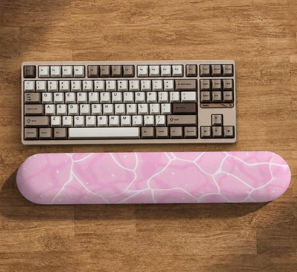 Soft pink mouse pad and wrist rest with a cloud-marble pattern, pale linework, and small star details.