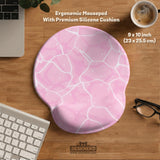 Soft pink mouse pad and wrist rest with a cloud-marble pattern, pale linework, and small star details.