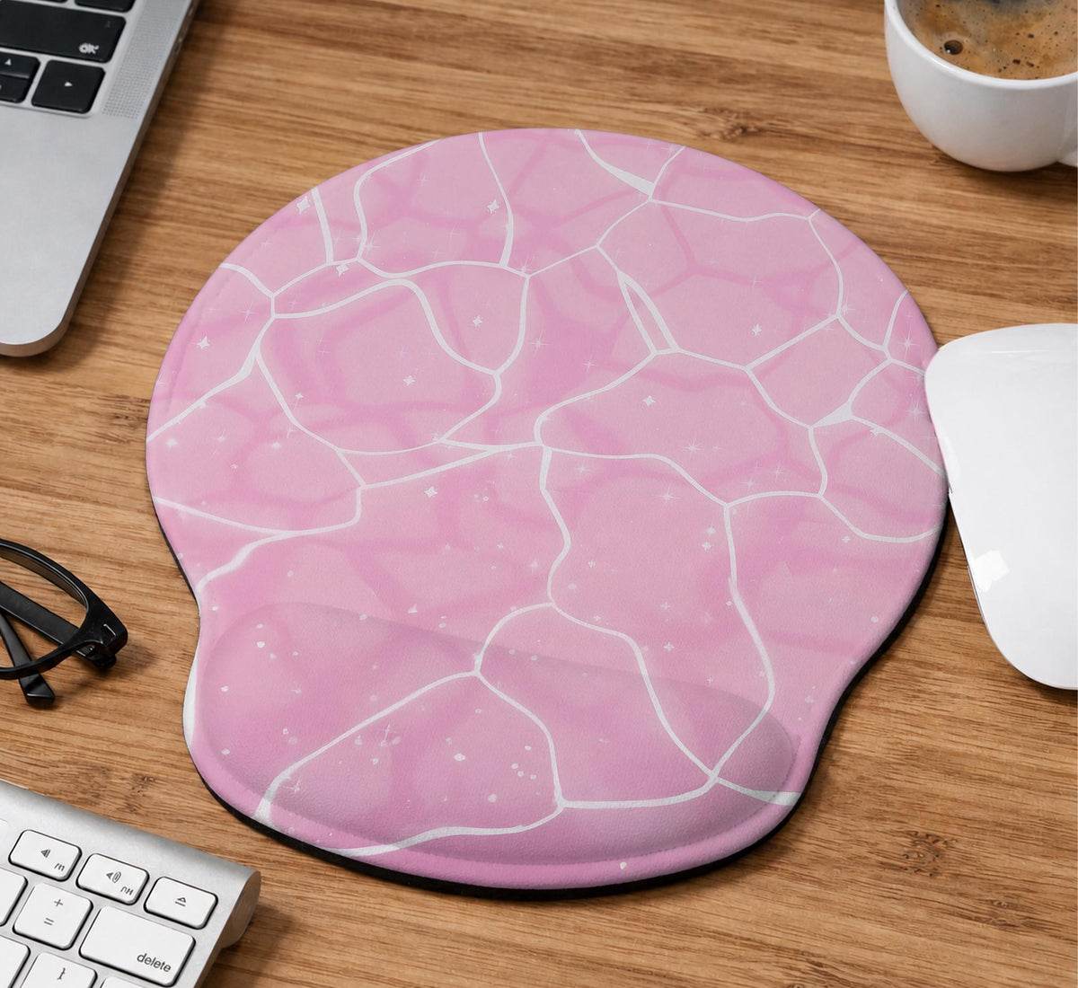 Soft pink mouse pad and wrist rest with a cloud-marble pattern, pale linework, and small star details.