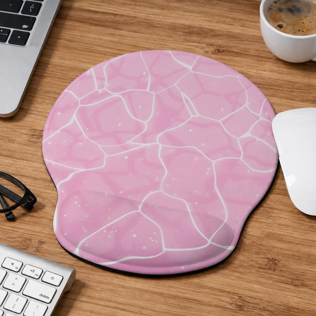 Soft pink mouse pad and wrist rest with a cloud-marble pattern, pale linework, and small star details.