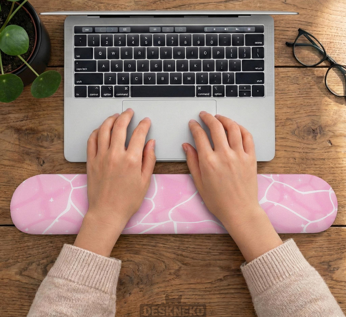 Soft pink mouse pad and wrist rest with a cloud-marble pattern, pale linework, and small star details.