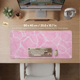 Soft pink desk mat with a kawaii cloud-marble pattern, white crackle lines, and small star accents.