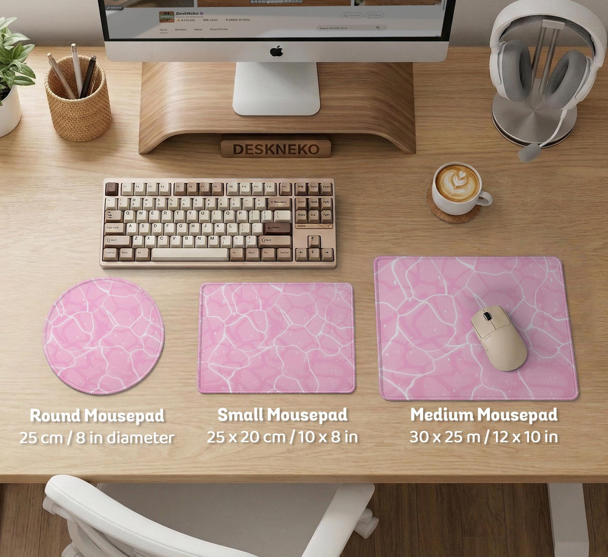 Pastel pink desk mat with a marble-style design, white flowing lines, and small sparkle accents.