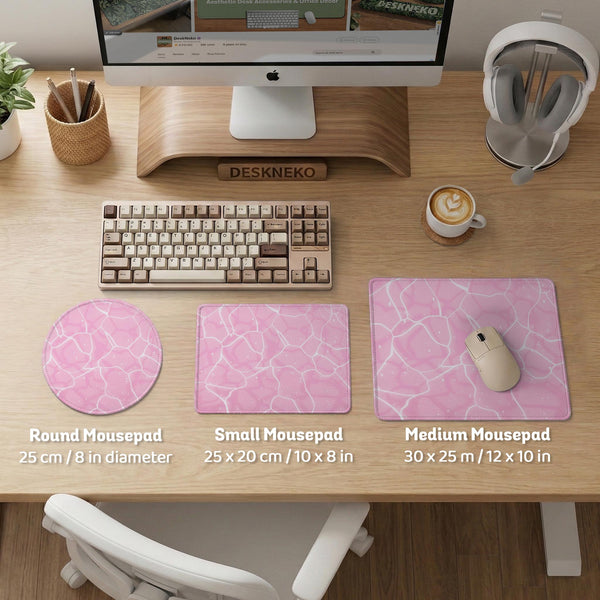 Soft pink desk mat with a kawaii cloud-marble pattern, white crackle lines, and small star accents.