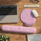 Pastel pink desk mat with a marble-style design, white flowing lines, and small sparkle accents.