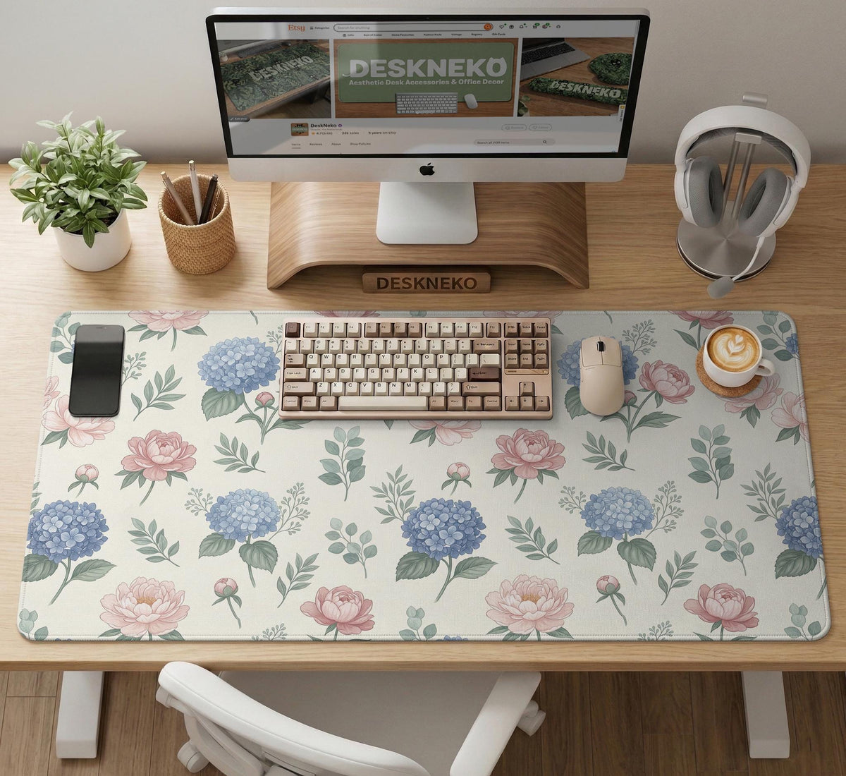 Floral desk mat with sage greenery, pink peonies, blue flowers, and a warm cream background.