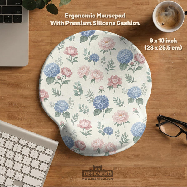 Mousepad and keyboard wrist rest with a floral print of blue hydrangeas, pink peonies, sage leaves, and a cream background.