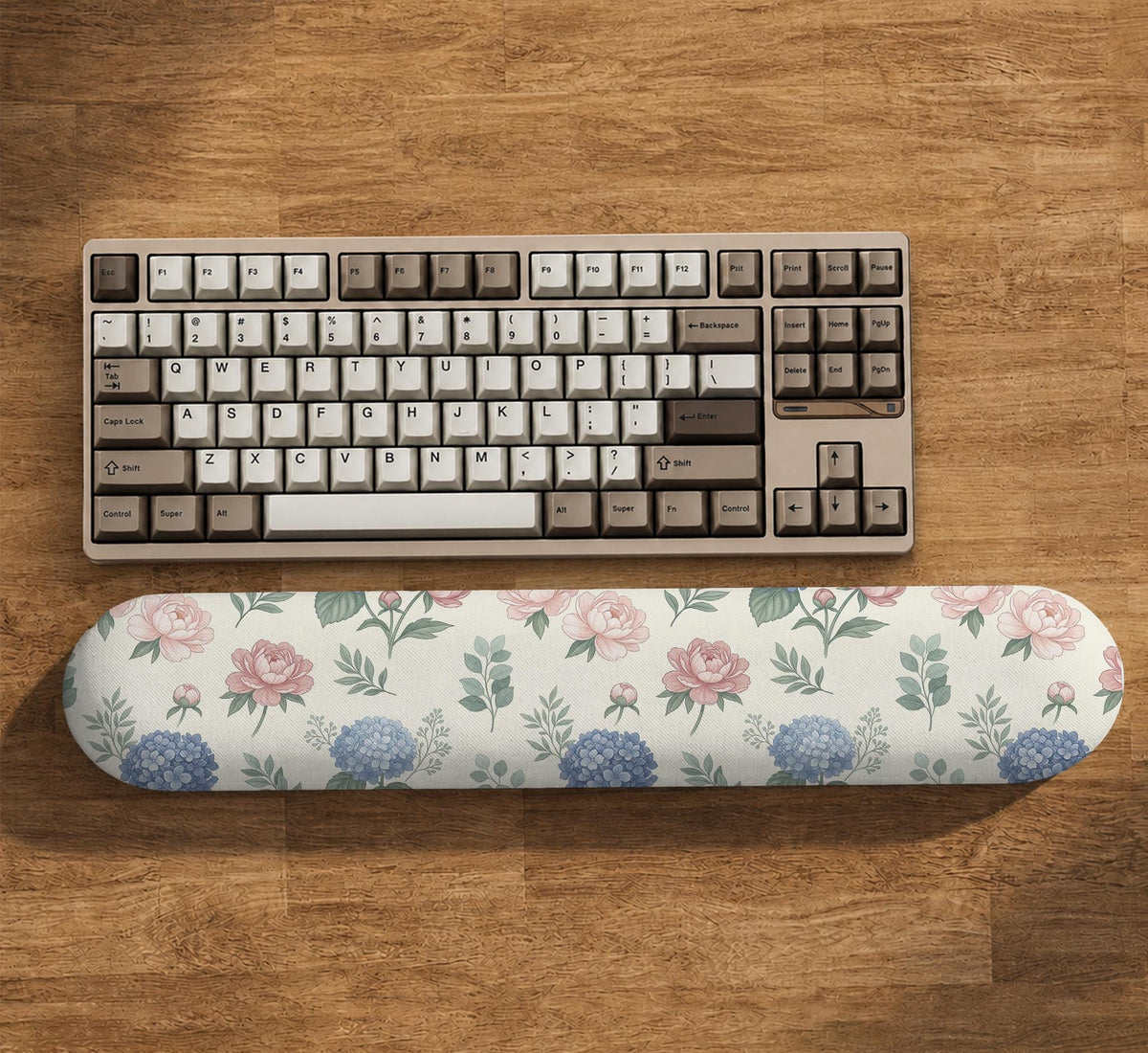 Mousepad and keyboard wrist rest with a floral print of blue hydrangeas, pink peonies, sage leaves, and a cream background.