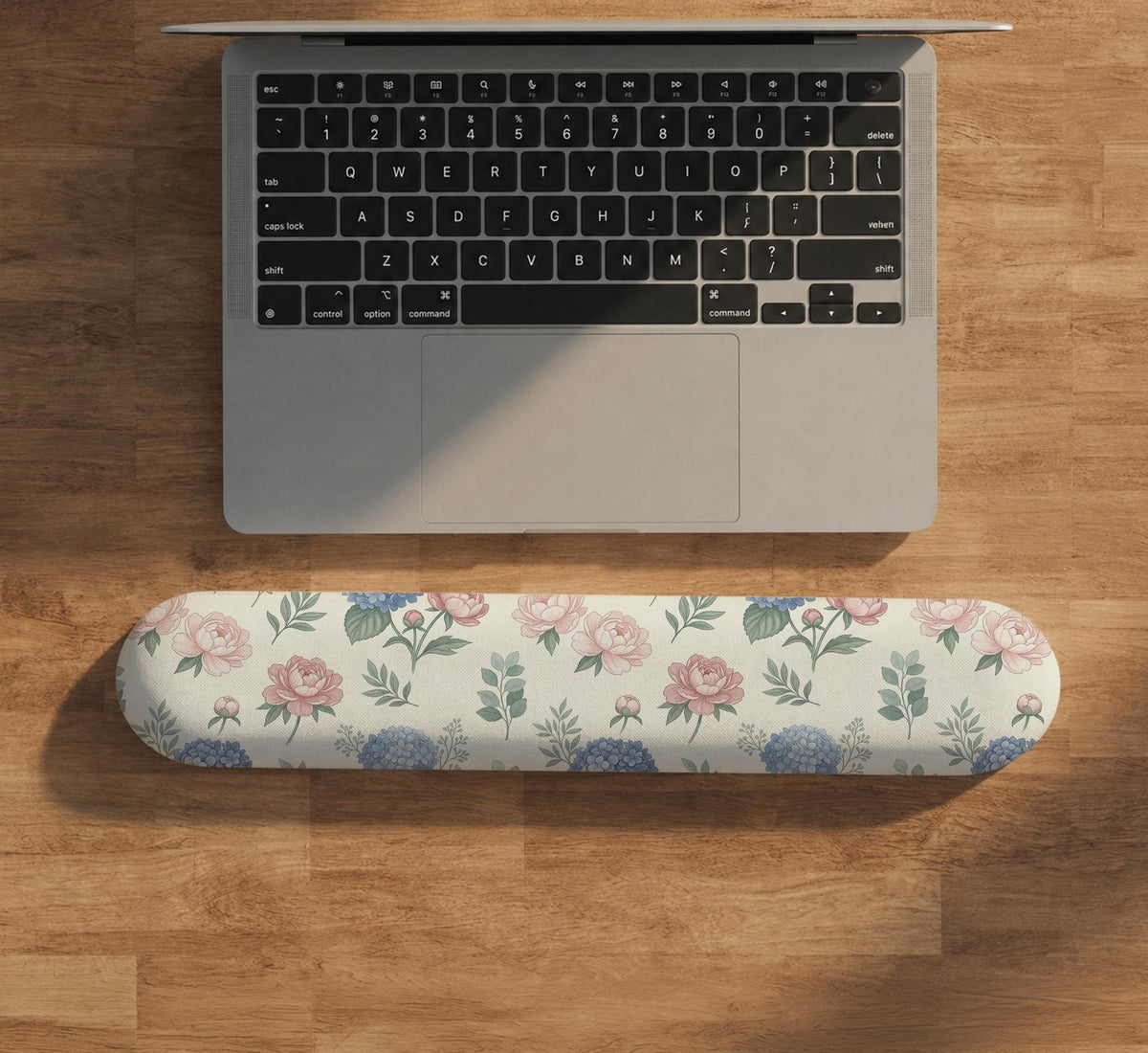 Mousepad and keyboard wrist rest with a floral print of blue hydrangeas, pink peonies, sage leaves, and a cream background.