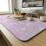 Lavender desk mat with an all-over pattern of bunny faces, clouds, moons, bows, and flowers in pastel colors.