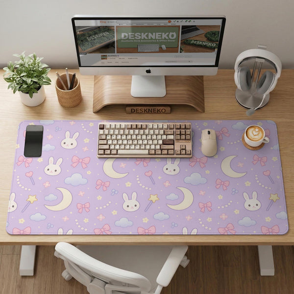 Pastel lavender desk mat with an all-over pattern of bunnies, crescent moons, clouds, bows, stars, and small flowers.