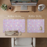 Lavender desk mat with an all-over pattern of bunny faces, clouds, moons, bows, and flowers in pastel colors.