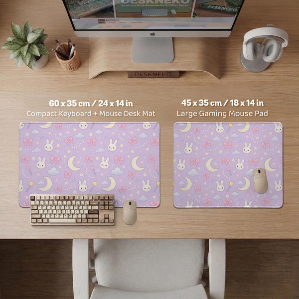 Lavender desk mat with an all-over pattern of bunny faces, clouds, moons, bows, and flowers in pastel colors.