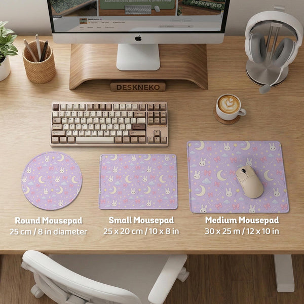Lavender desk mat with an all-over pattern of bunny faces, clouds, moons, bows, and flowers in pastel colors.