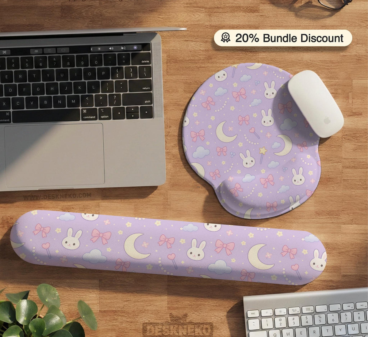Lavender desk mat with an all-over pattern of bunny faces, clouds, moons, bows, and flowers in pastel colors.