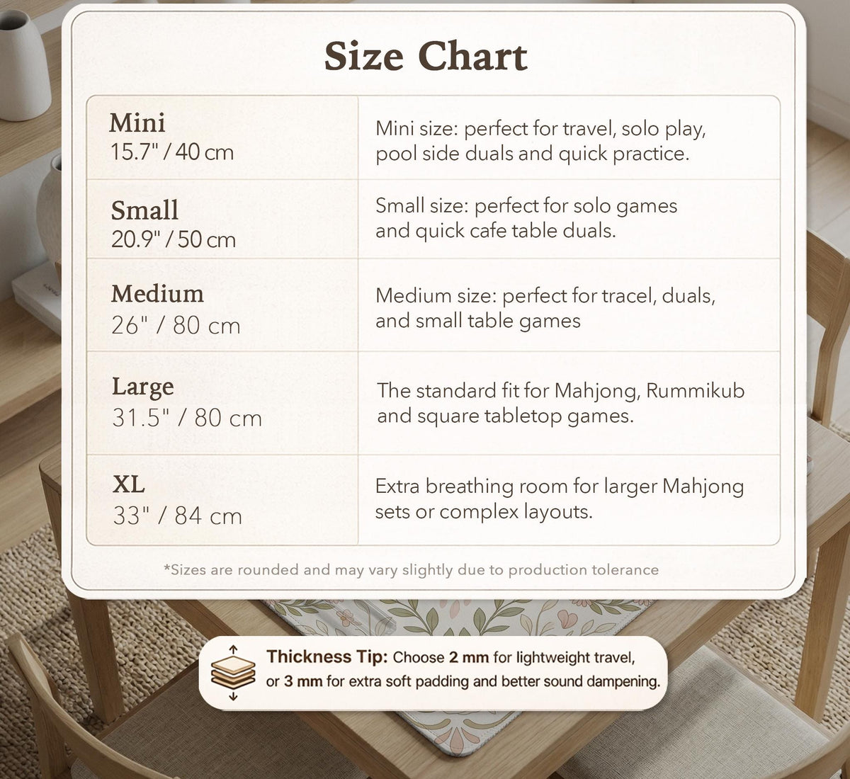 Square mahjong mat with a light floral border in sage green, cream, and blush around a plain center play area.