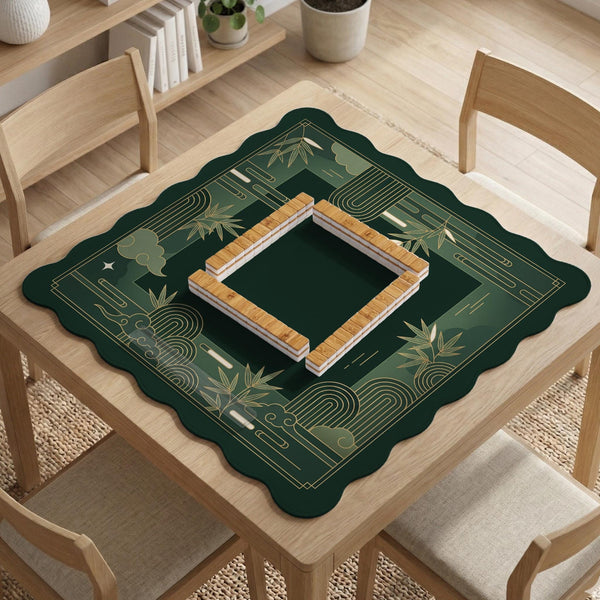 Square emerald green mahjong mat with bamboo line art, gold geometric cloud shapes, and a plain center playing area.