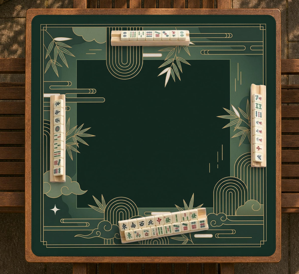 Square emerald green mahjong mat with bamboo line art, gold geometric cloud shapes, and a plain center playing area.