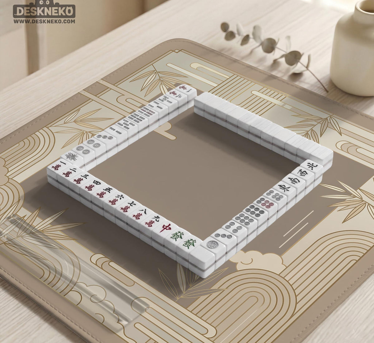 Beige and gold square mahjong mat with a bamboo pattern and geometric border.
