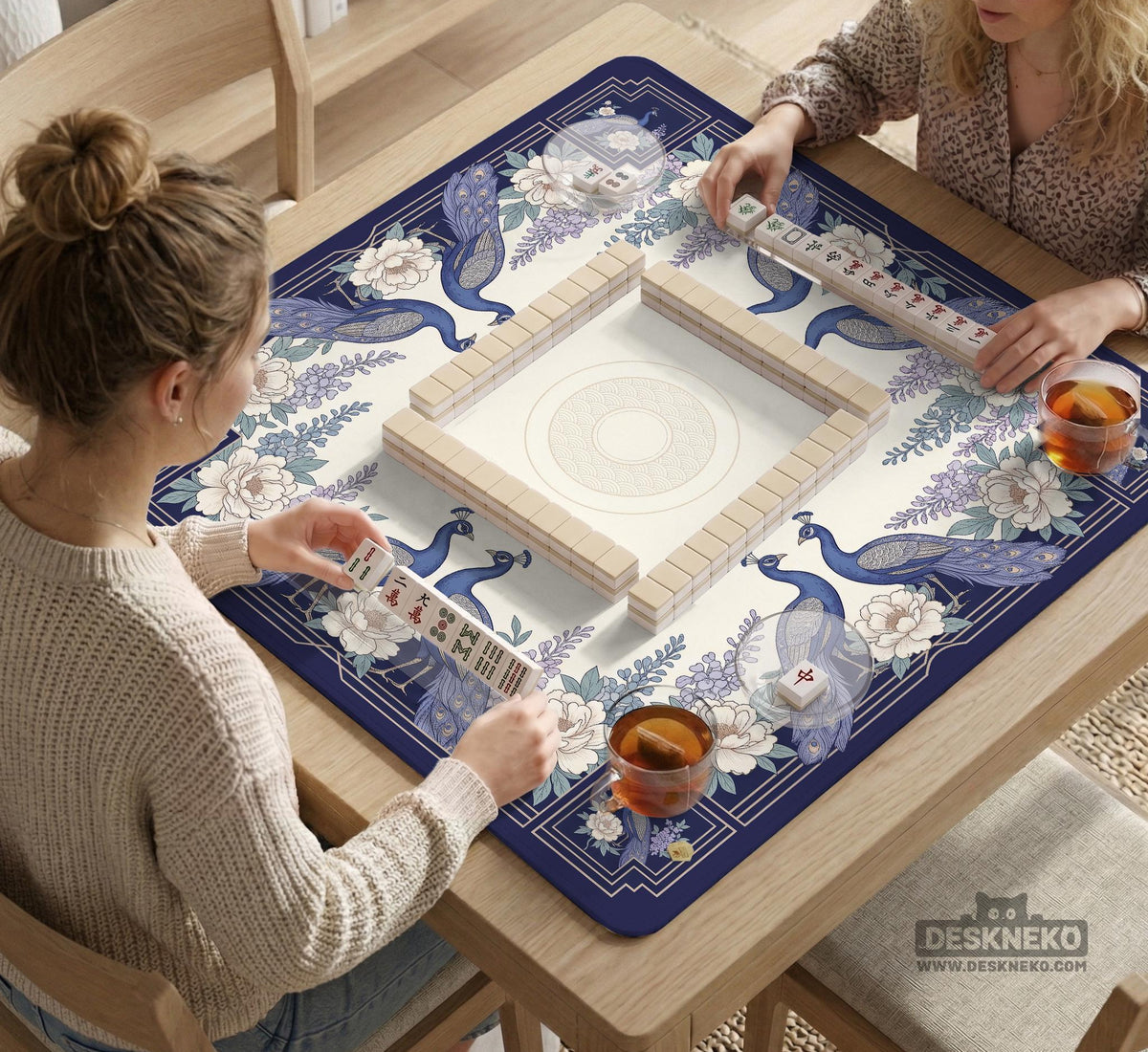 Blue mahjong table mat with a peacock and floral border, ivory center, lavender flowers, and scalloped edges.