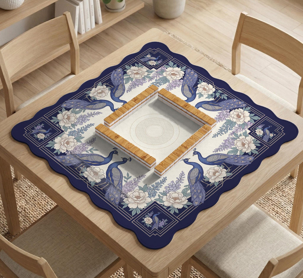 Blue mahjong table mat with a peacock and floral border, ivory center, lavender flowers, and scalloped edges.