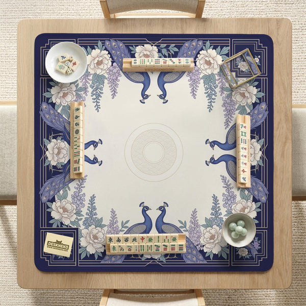 Blue mahjong mat with a floral peacock border and an open center area for tile play.