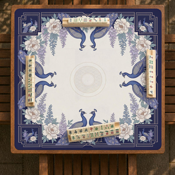Blue mahjong mat with a floral peacock border and an open center area for tile play.