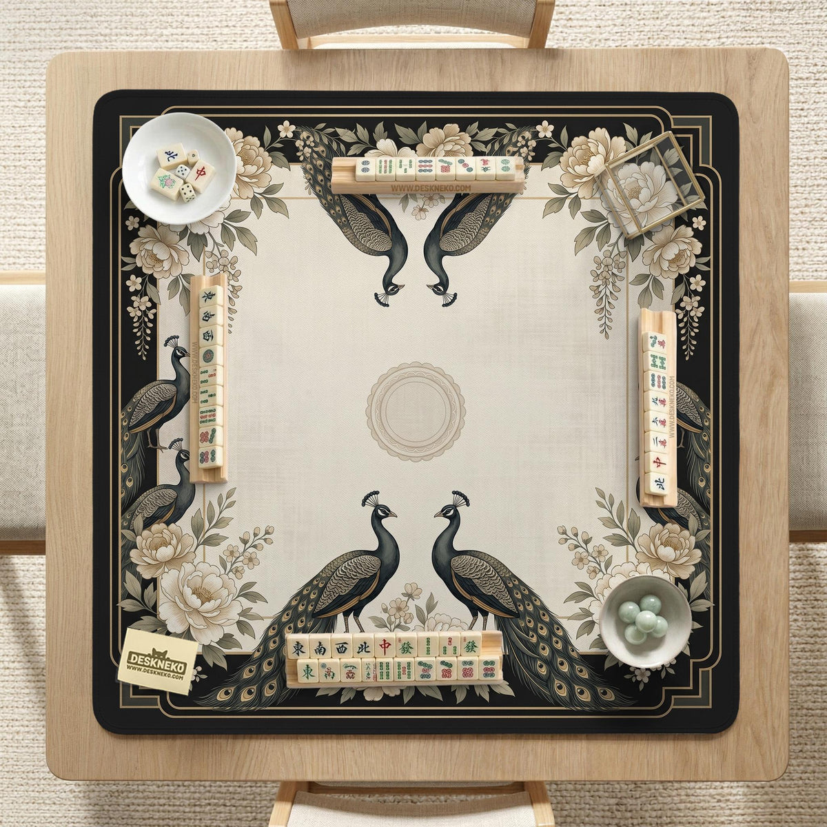 Square ivory mahjong mat with a black peacock border, cream flowers, and gold accent details.