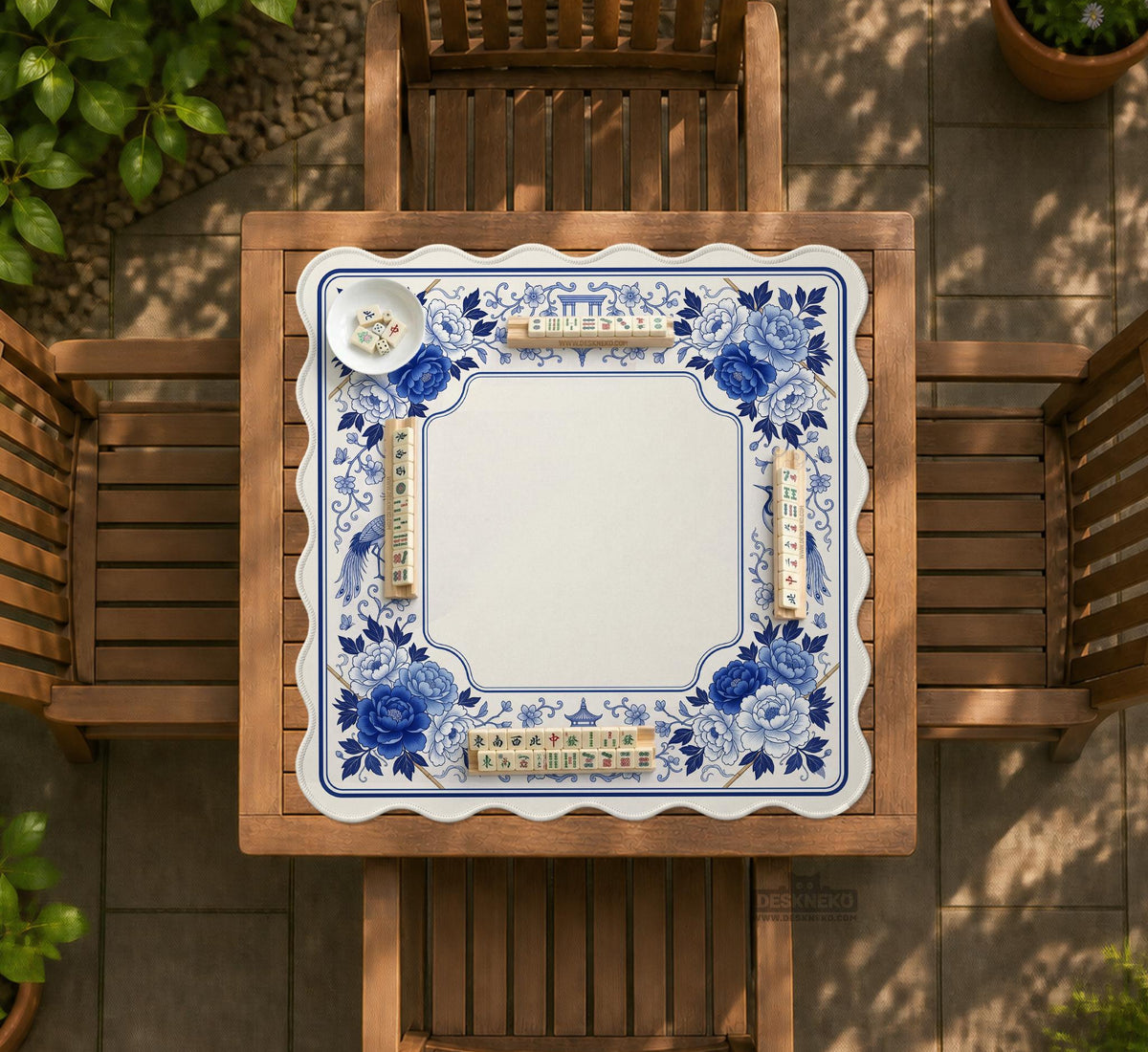 Square blue and white mahjong mat with peonies, cranes, pagoda accents, and chinoiserie linework around a plain center.