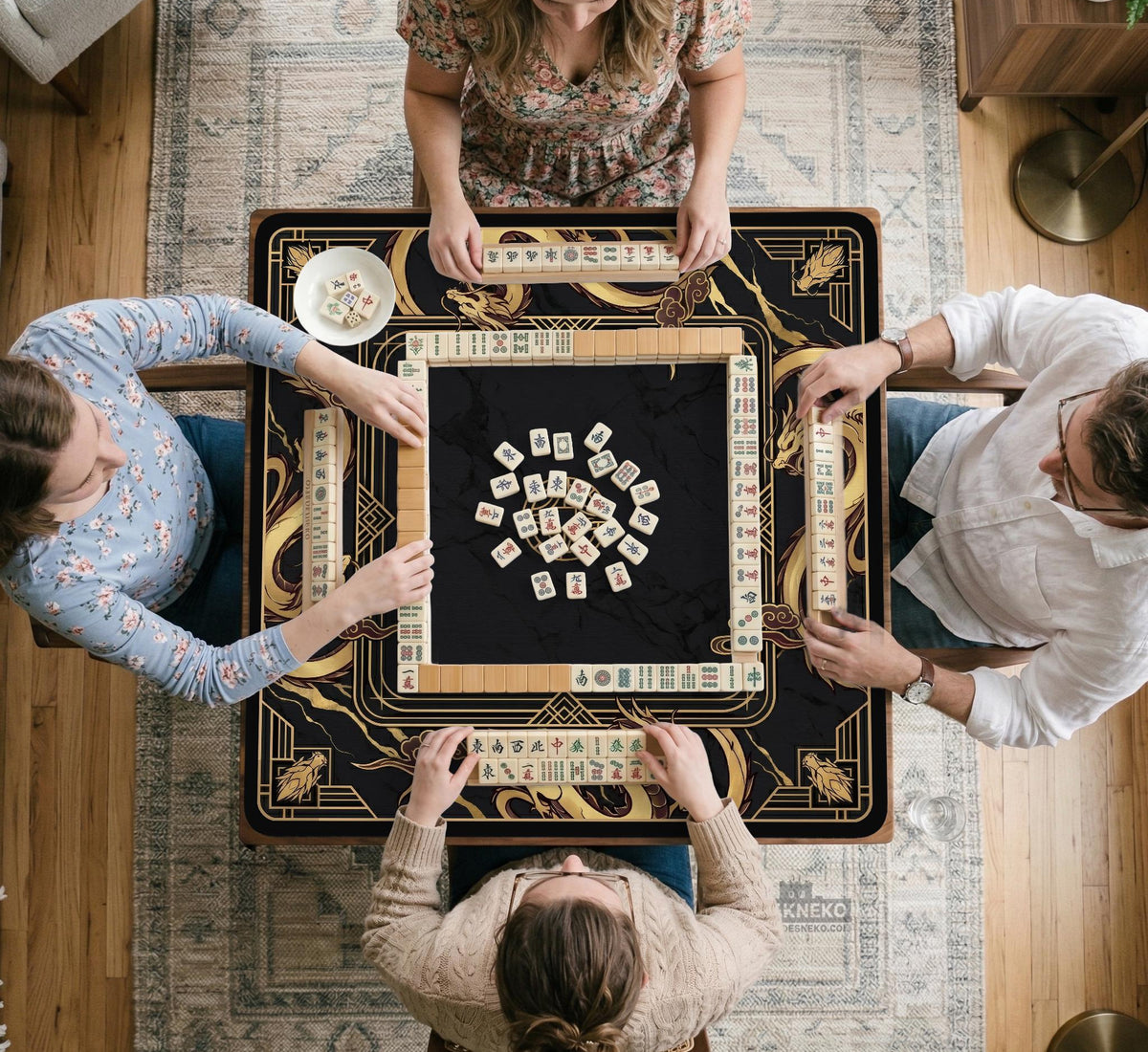 Black mahjong table mat with a gold dragon border, gold geometric corner details, and a clear center play area.
