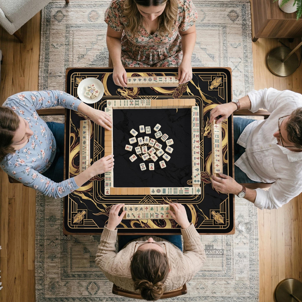Square black mahjong mat with gold dragon artwork around the border and a light marble texture in the center.