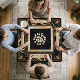 Square black mahjong mat with gold dragon artwork around the border and a light marble texture in the center.