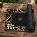 Square black mahjong mat with gold dragon artwork around the border and a light marble texture in the center.