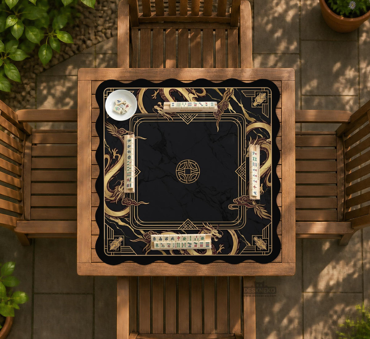 Black mahjong table mat with a gold dragon border, gold geometric corner details, and a clear center play area.
