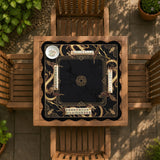Square black mahjong mat with gold dragon artwork around the border and a light marble texture in the center.