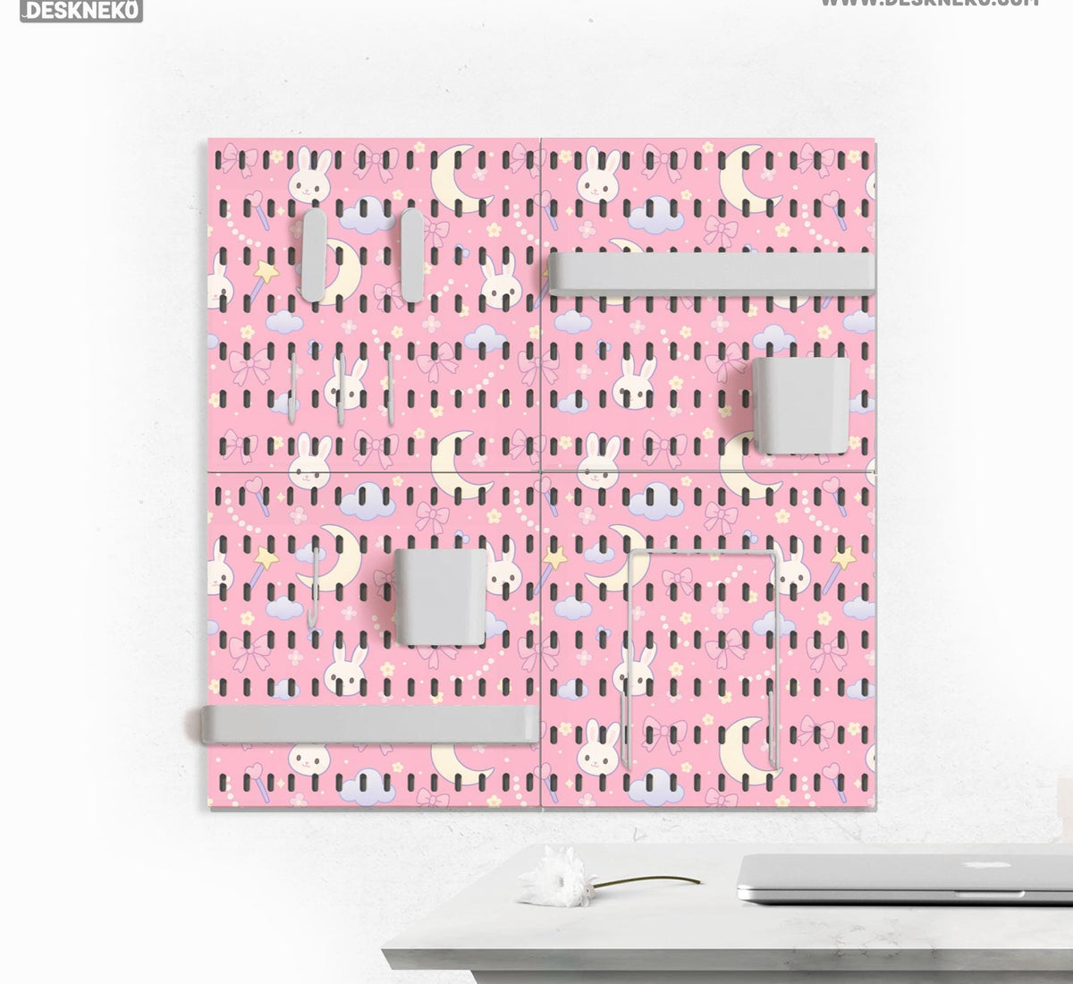 Pink pegboard panels with a kawaii bunny, cloud, moon, bow, and star pattern shown as a wall organizer set.