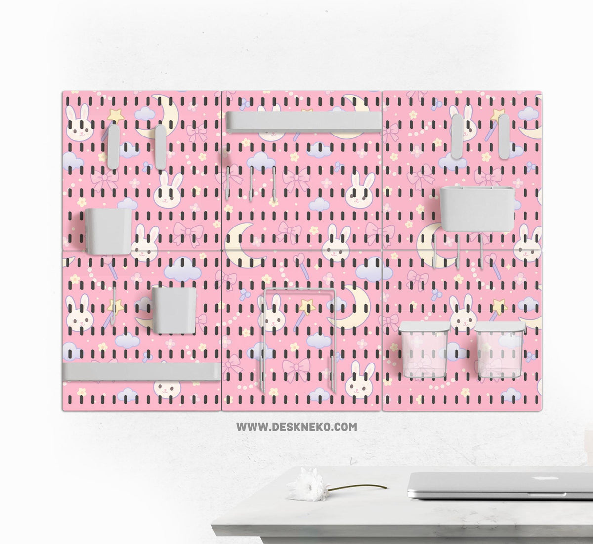 Pink pegboard panels with a kawaii bunny, cloud, moon, bow, and star pattern shown as a wall organizer set.