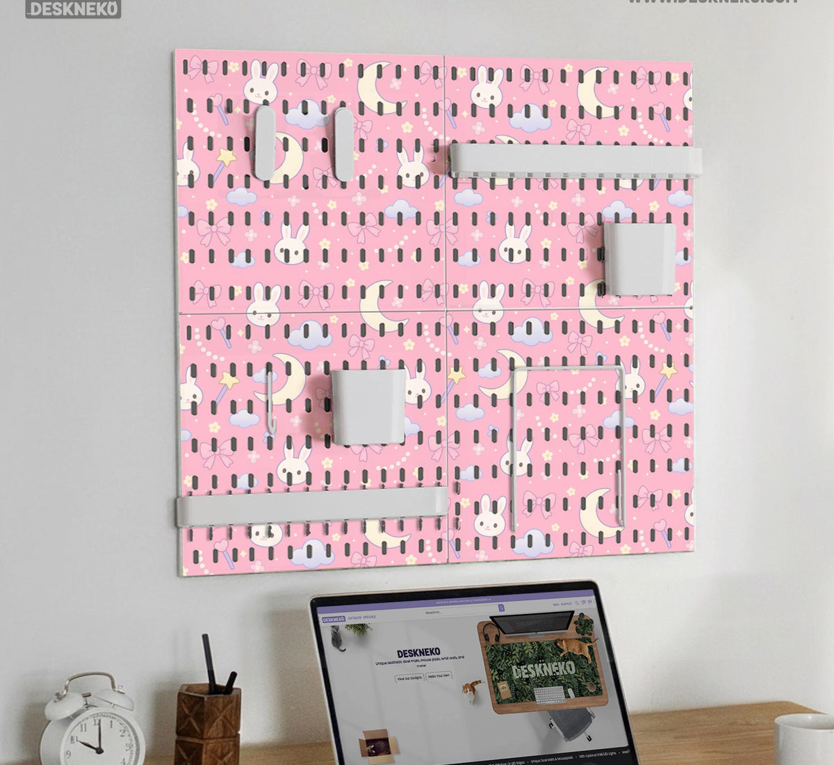 Pink pegboard panels with a kawaii bunny, cloud, moon, bow, and star pattern shown as a wall organizer set.